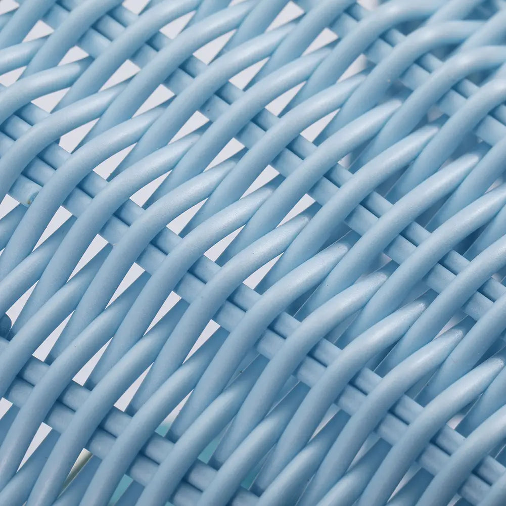 Light blue woven plastic wicker texture of kids woven bicycle basket set with bell and tassels.