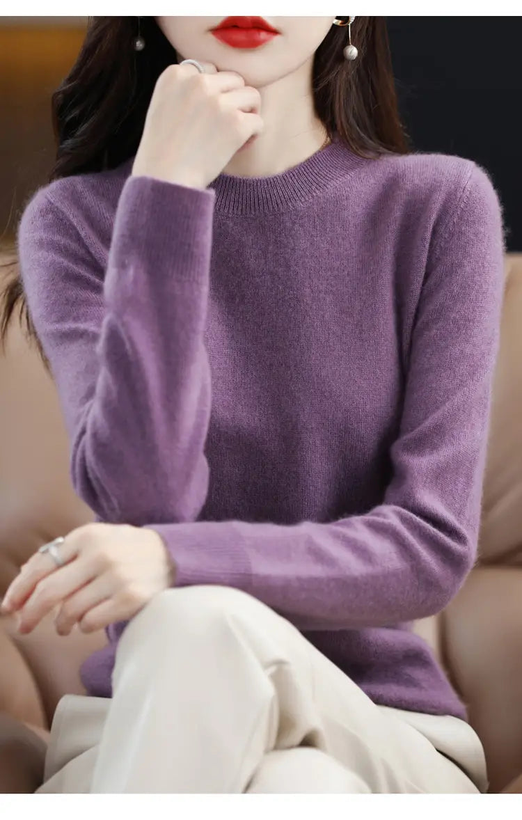 A soft lavender-colored pure wool cashmere o-neck pullover sweater with long sleeves.