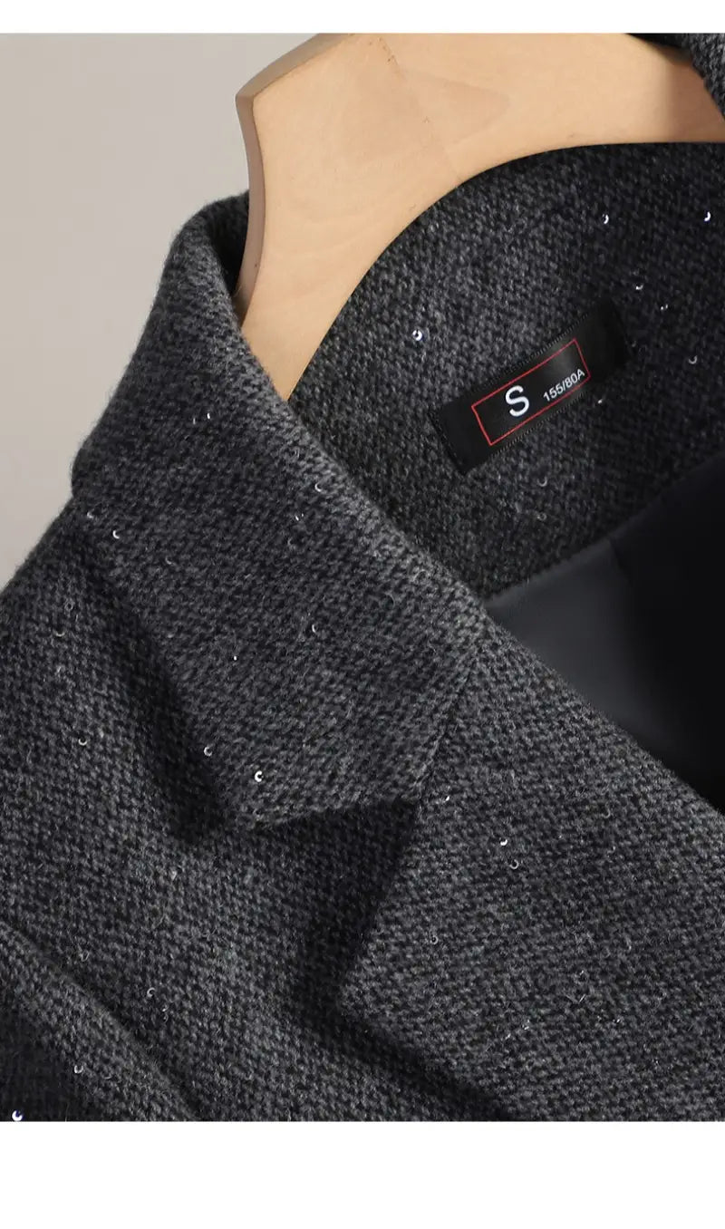 dark gray wool blend double breasted blazer featuring subtle shimmering sequins along the collar and shoulders
