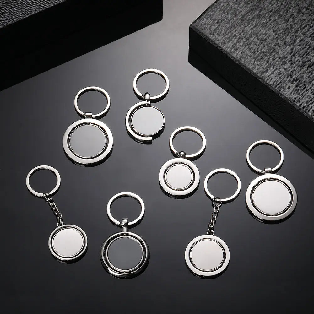 Rotating silver circle keychain gift featuring polished metal rings and a double-sided rotating design with smooth reflective surfaces.