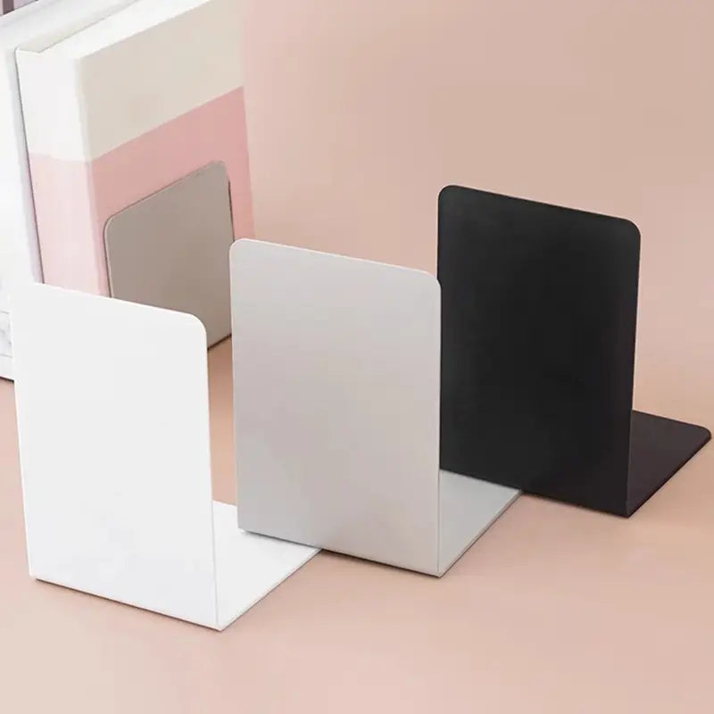 Minimalist metal l shaped bookends in white silver and black designed for desktop use.