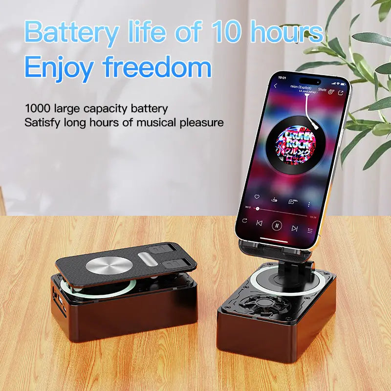 Black and silver portable bluetooth speaker with magnetic phone stand designed for cell phone use
