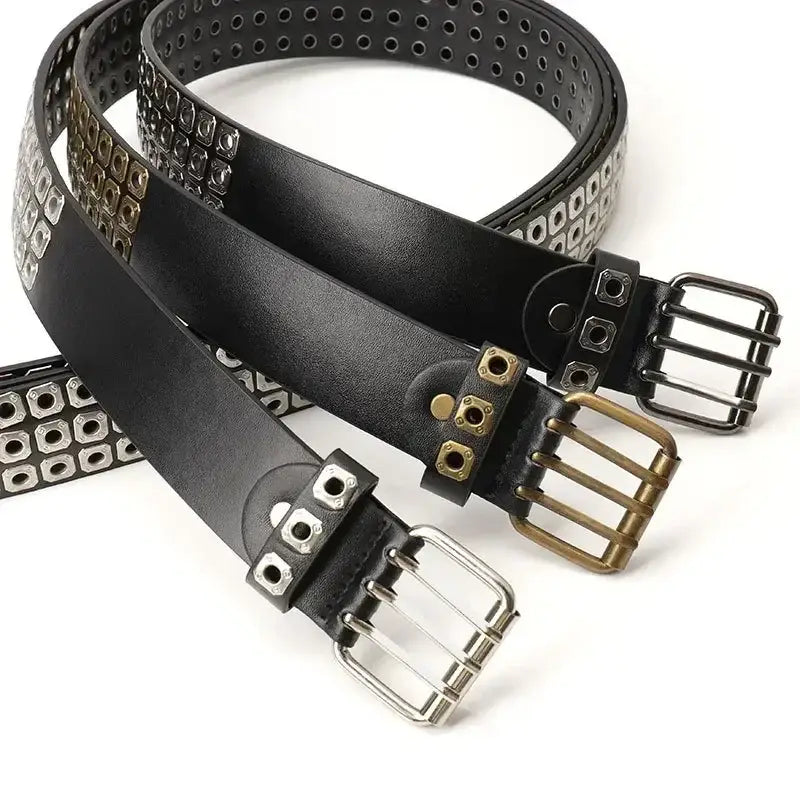 Black leather studded punk belt featuring rows of silver and brass-colored square studs and matching metal buckles.
