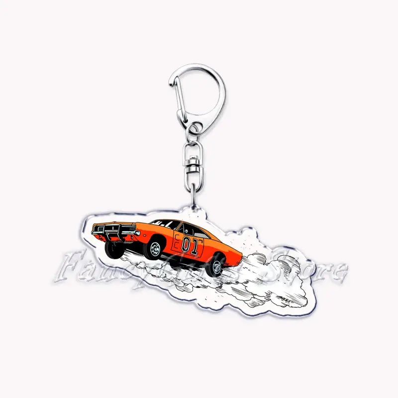Orange acrylic Nissan Skyline keychain featuring a classic muscle car with the number 01 on its side depicted in motion against stylized smoke.
