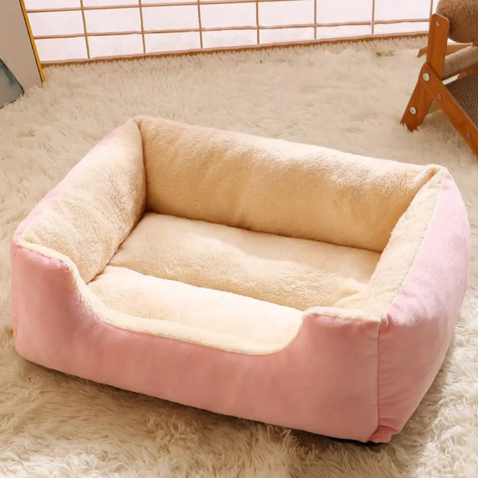 plush rectangular cat bed with soft cushioned pink and cream sides and a cozy interior for pet comfort