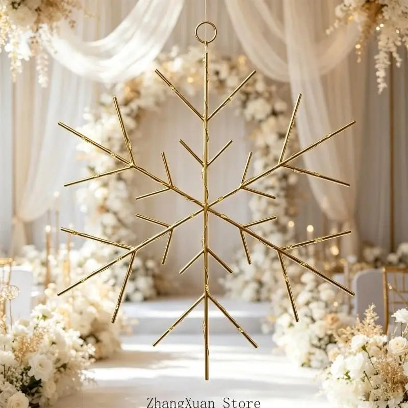 Gold-colored metallic snowflake Christmas tree and wreath ornament with a circular top loop for hanging.