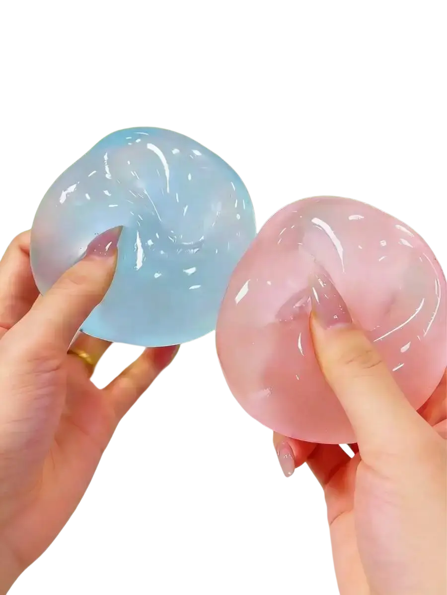 Two translucent gel-like moldable slow rebound stress balls in light blue and pink held in hands with manicured nails