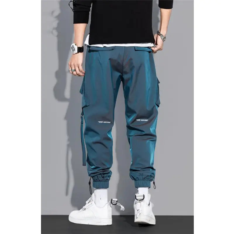Teal mens tactical cargo pants streetwear with multiple side pockets and drawstring cuffs designed for practical use.