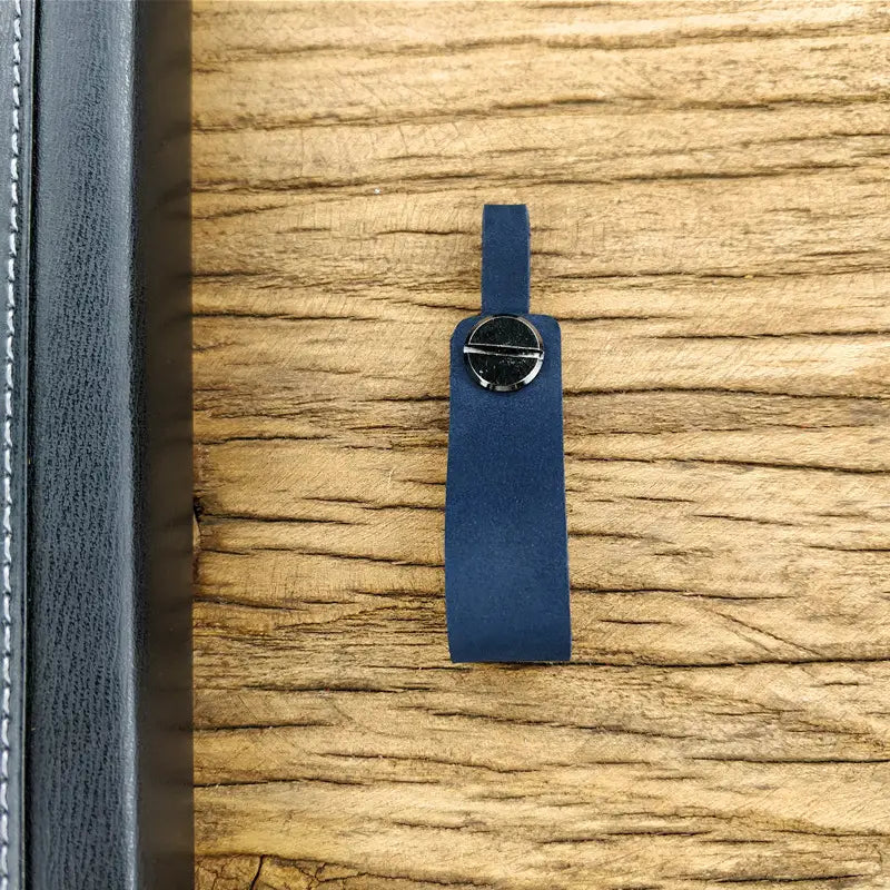 A navy blue genuine leather car keychain with a silver-toned circular clasp and metal key ring set.