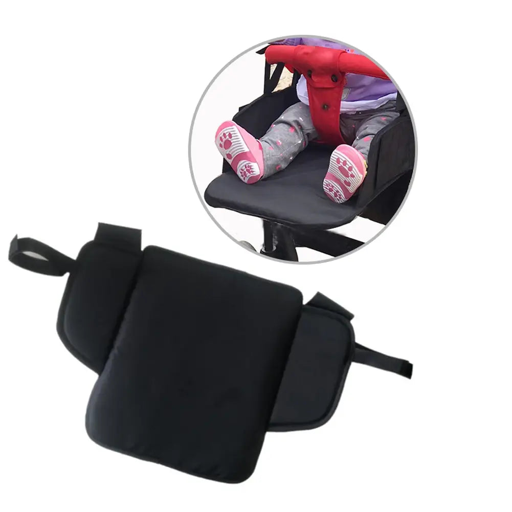 Black padded universal stroller extension footrest seat insert with adjustable straps for infant comfort and support.