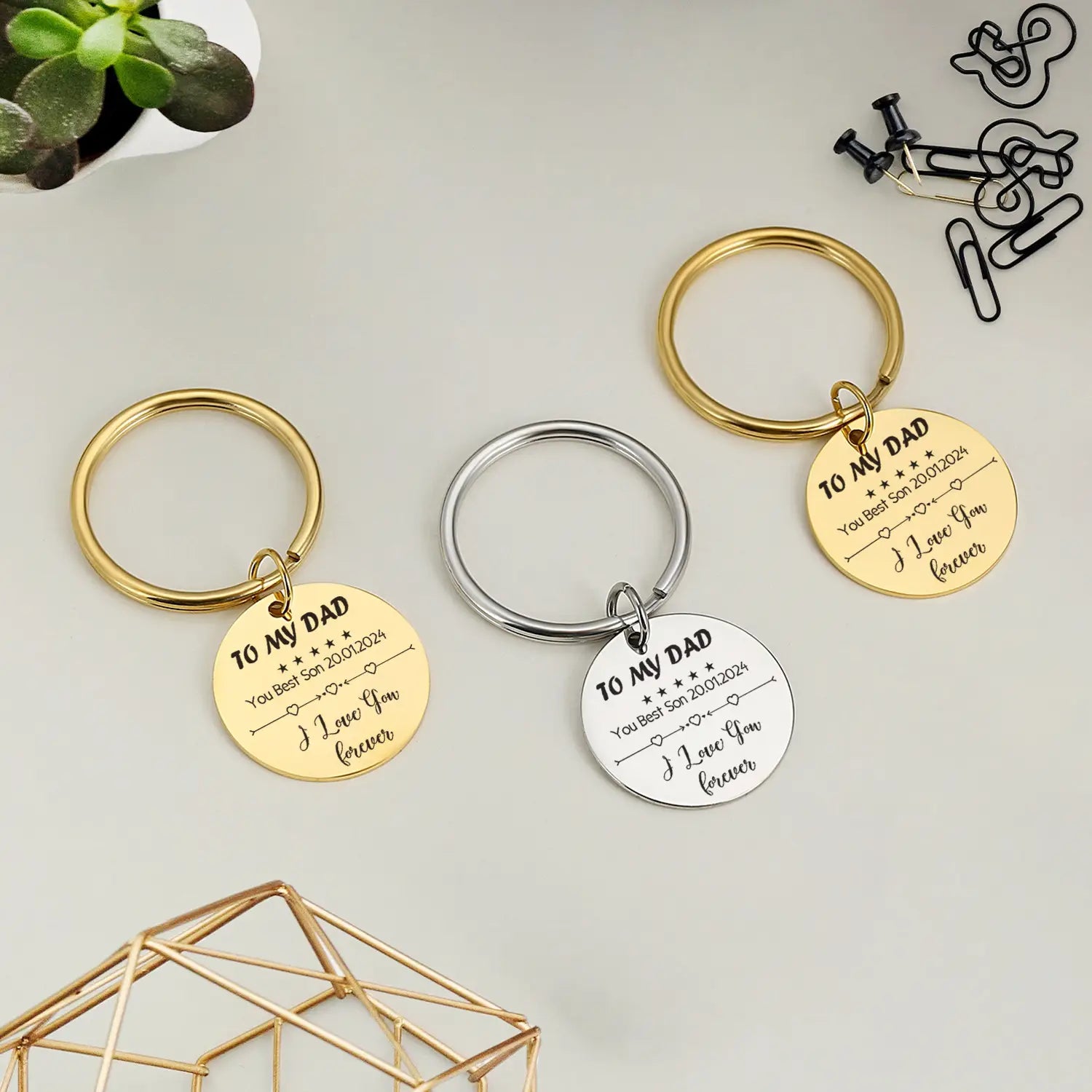personalized fingerprint qr code keychain gift featuring gold and silver metallic keychains with engraved circular charms reading to my dad and i love you forever with dates stars and heart designs