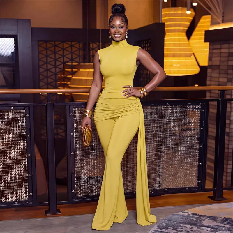 A vibrant yellow form-fitting high neck jumpsuit with ruched detail flare leg and side slit showcasing a zipper closure type in sets woman outfits.