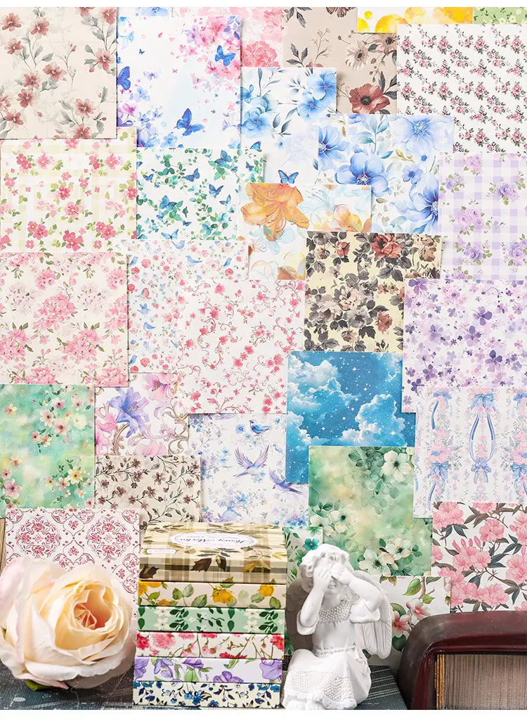vintage scrapbooking paper featuring delicate floral and nature-themed designs with butterflies blossoms and sky motifs in soft pastel hues for journaling and crafting.
