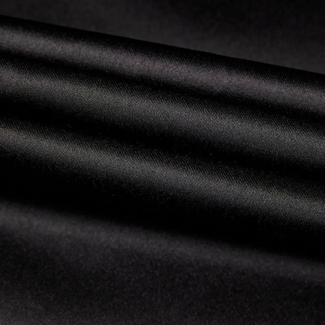 black satin fabric with a smooth glossy finish and subtle sheen featured in a gold sequin sleeve black satin blazer for men