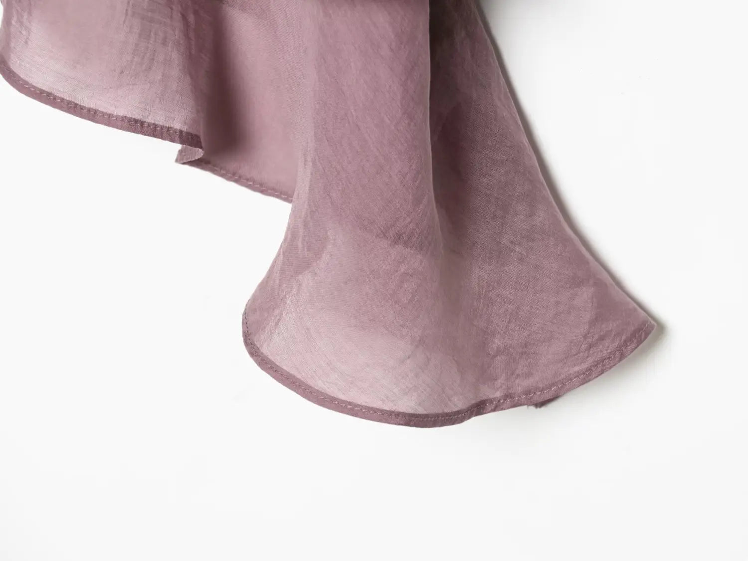 brown chiffon flare sleeve blouse with soft lavender-colored flowing fabric featuring a subtle sheen and delicate stitching along the hem highlighting the sleeve style