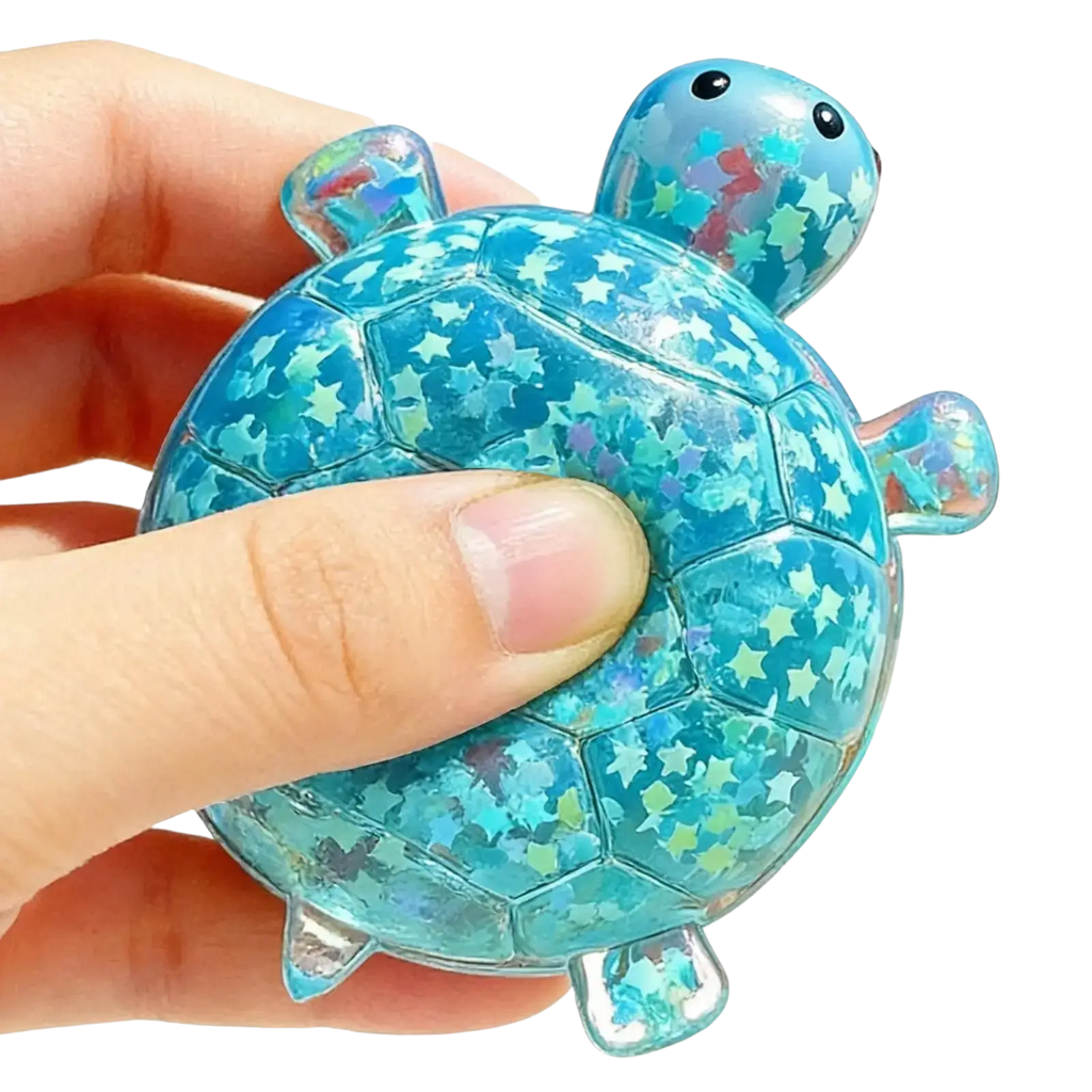 A translucent blue turtle shape squeeze toy filled with sparkling star confetti for sensory stress relief