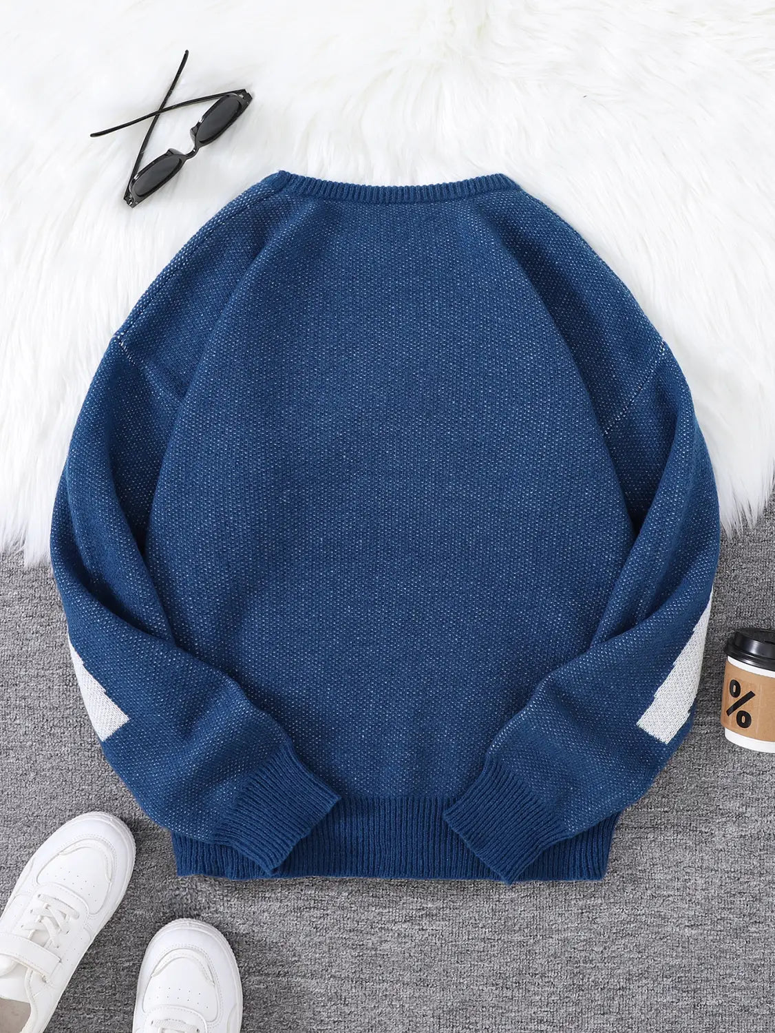 Men black amazing graphic knit sweater in navy blue featuring white diagonal stripes on the sleeves in a comfortable knit material.