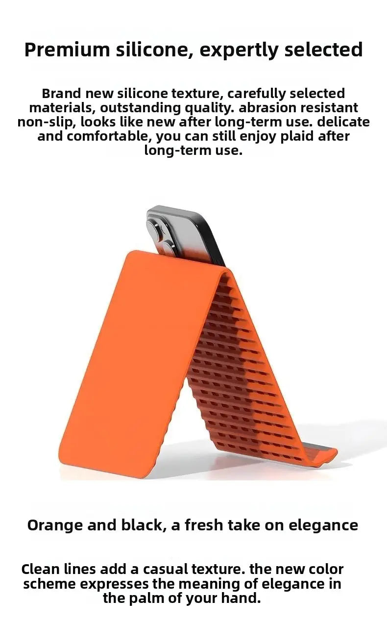 Soporte para teléfono plegable tipo perezoso de silicona en color naranja, con agarre texturizado negro y un diseño moderno y sofisticado.