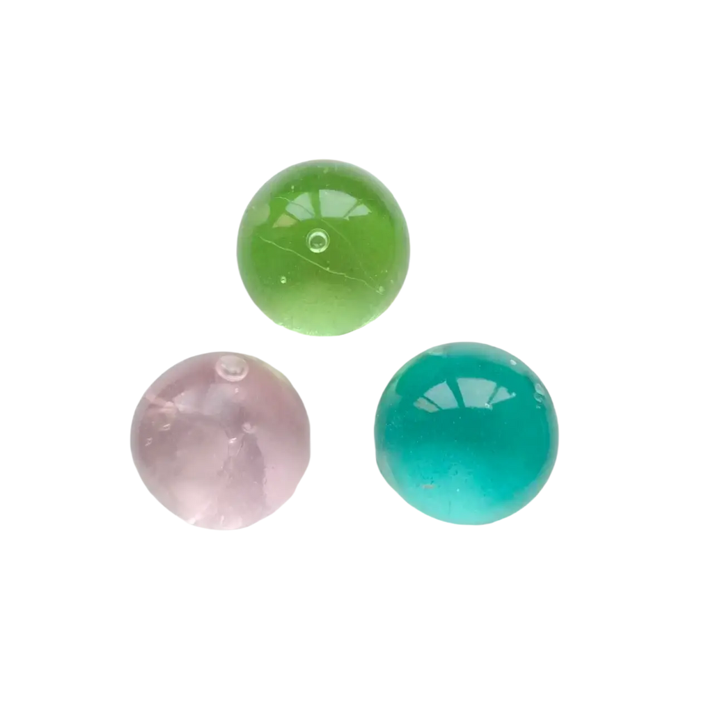 Three translucent gel beads in pastel pink green and teal blue as squishy stress balls for sensory fidget use