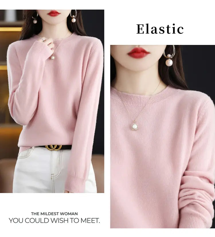 Soft pink pure wool cashmere o-neck pullover sweater with long sleeves, round neckline, and ribbed cuffs.