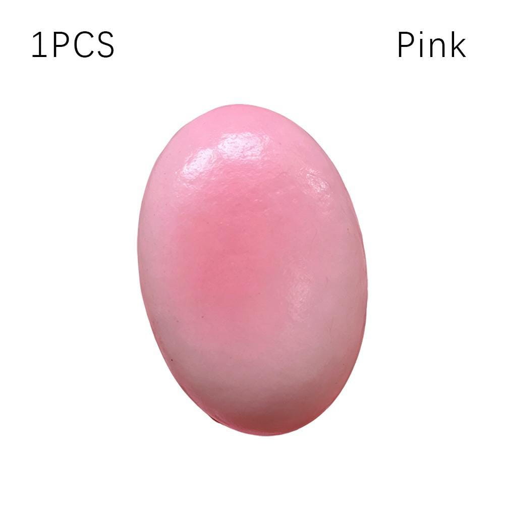 Un pastel de queso esponjoso y blando de color rosa liso, ovalado y suave, para aliviar el estrés, lento en elevarse, con acabado brillante.