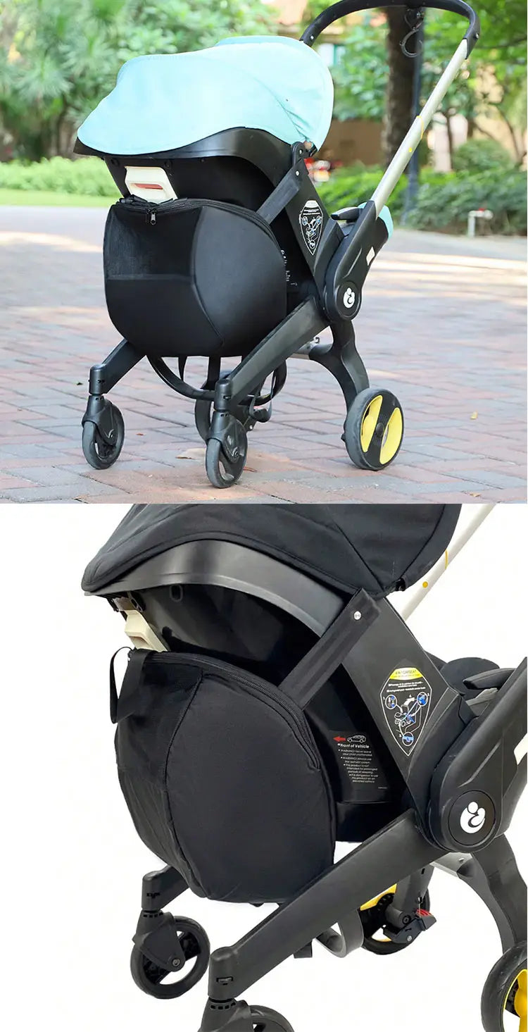 Schwarze Stoff-Aufbewahrungstasche mit gelb akzentuierten Rädern, entwickelt, um sicher unter einem Kinderwagen zu befestigen, der im Produkt „Doona-Kinderwagen-Aufbewahrungstasche als umwandelbarer Reise-Rucksack“ zu sehen ist.