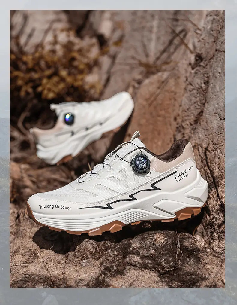Men hiking shoes featuring white and tan colors with black lightning bolt detailing and a boa-style dial closure system designed for lightweight and waterproof trekking sneakers.