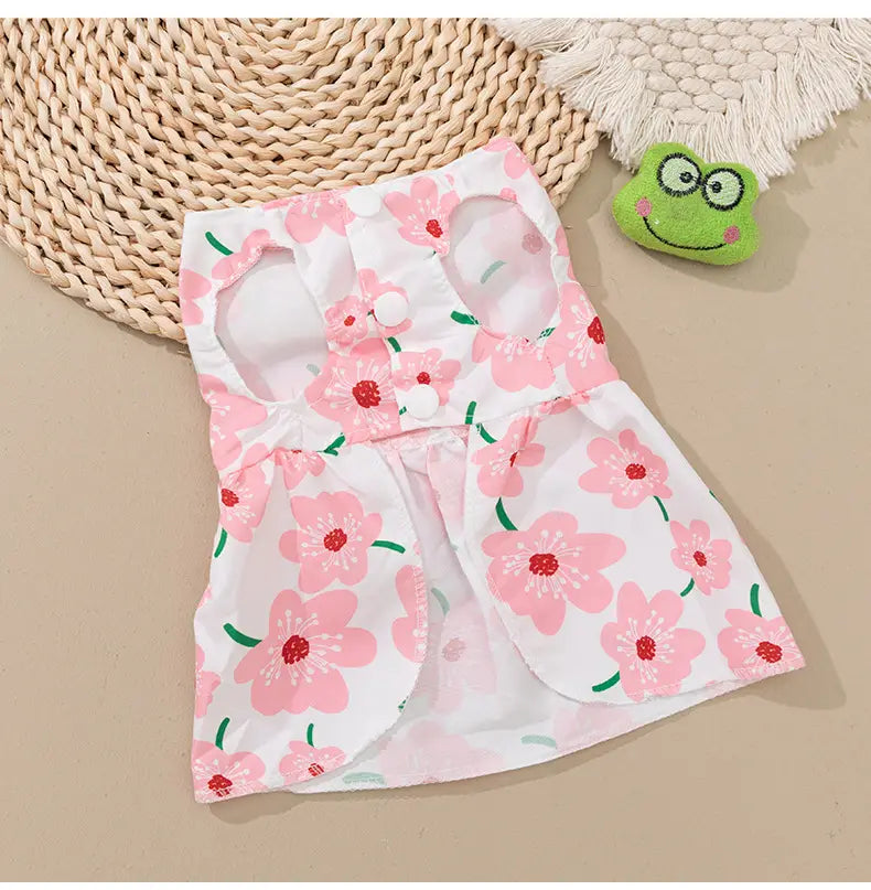 floral dog princess dress with bow featuring pink floral pattern on white fabric with green stems and a cute design