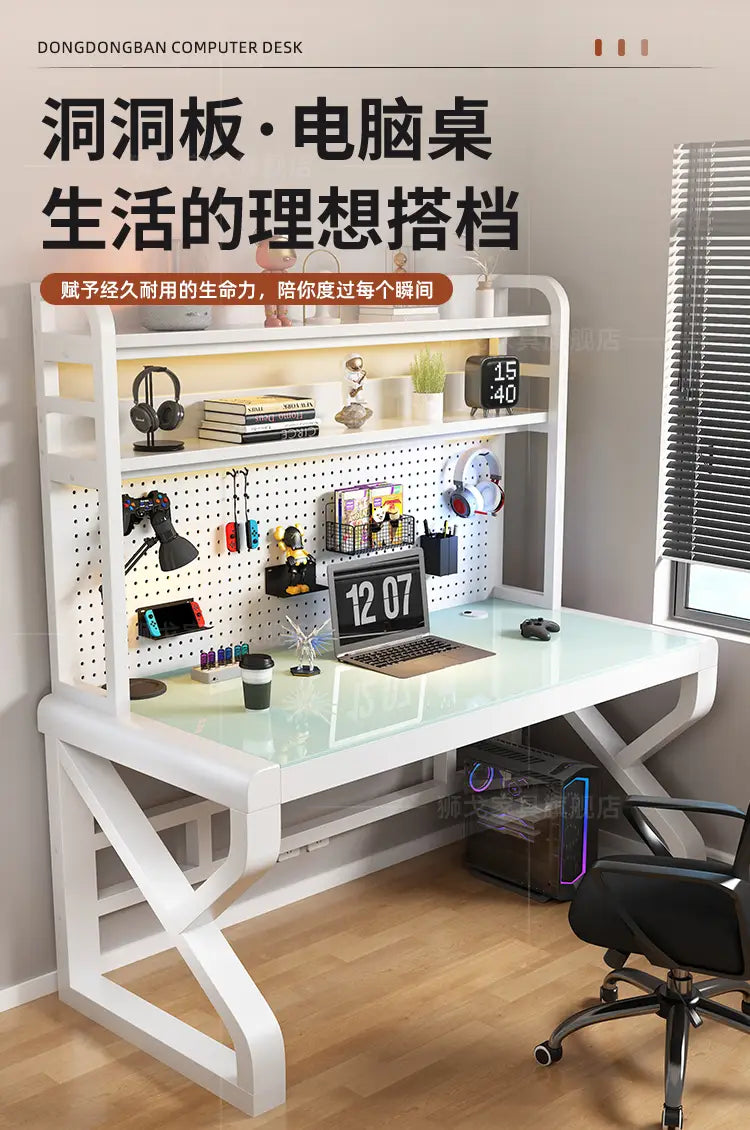 White modern glass office desk with a glass top and pegboard organizer featuring storage shelves for efficient workspace organization.