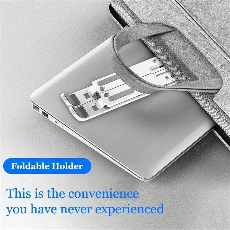 Silver metallic adjustable foldable laptop stand with a sleek minimalist design for desk use.
