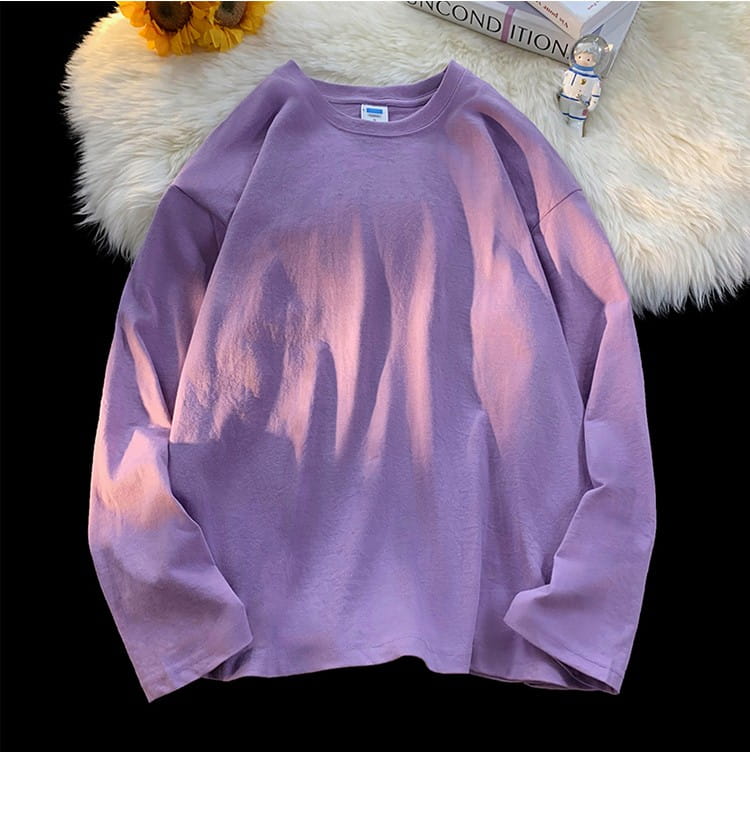 A soft lavender oversized long sleeve blank t-shirt featuring a subtle gradient effect and a simple crew neck design.