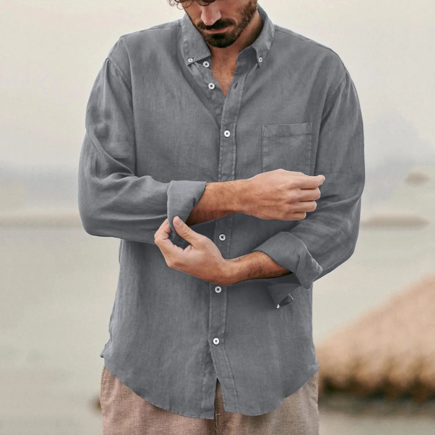 Men linen blend casual shirt in gray featuring a button-down design with a chest pocket and rolled-up sleeves.