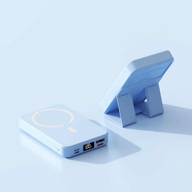 Light blue rectangular magnetic power bank with circular charging pad and digital display showing 100 percent charge offering fast charging support and phone stand functionality.