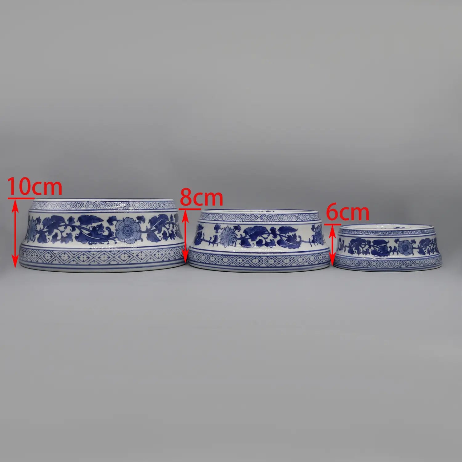 three feeding bowl ceramic made of blue and white porcelain with intricate floral patterns along the rim in a feeding bowl ceramic blue floral porcelain set