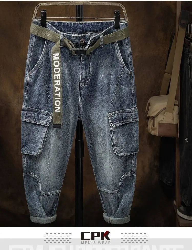 Men denim cargo jeans casual loose pants in blue denim with an olive green belt featuring moderation text