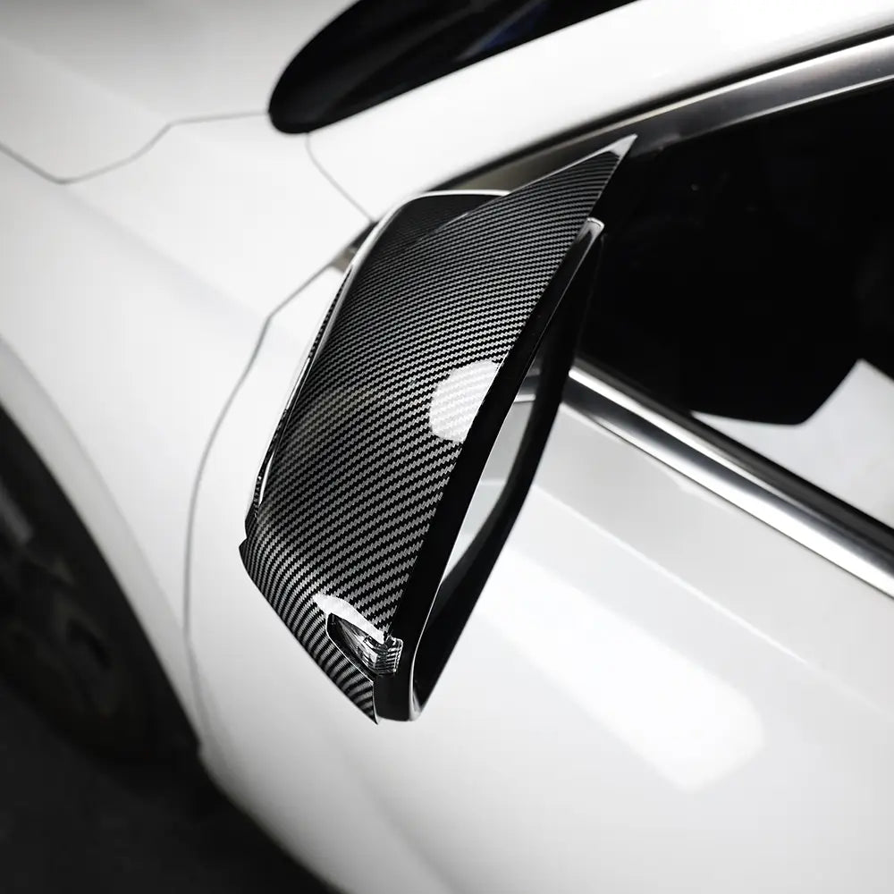 Carbon fiber side mirror cover in black for white Hyundai Palisade led mirror covers 2020-2025 shown from the back side.
