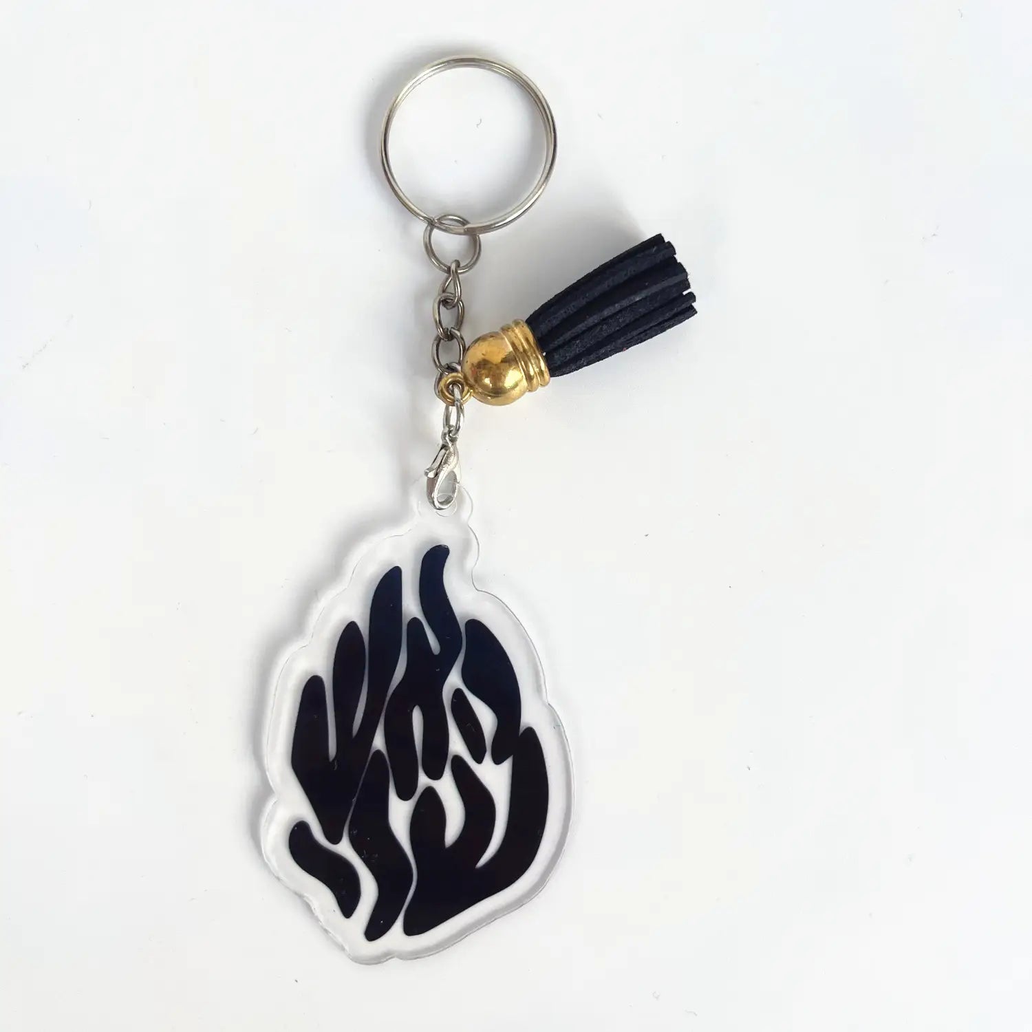 Clear acrylic keychain featuring a black flame design with a gold-toned bead and black tassel included in a Jewish blessing card acrylic keychain party favor set of 10 pieces.