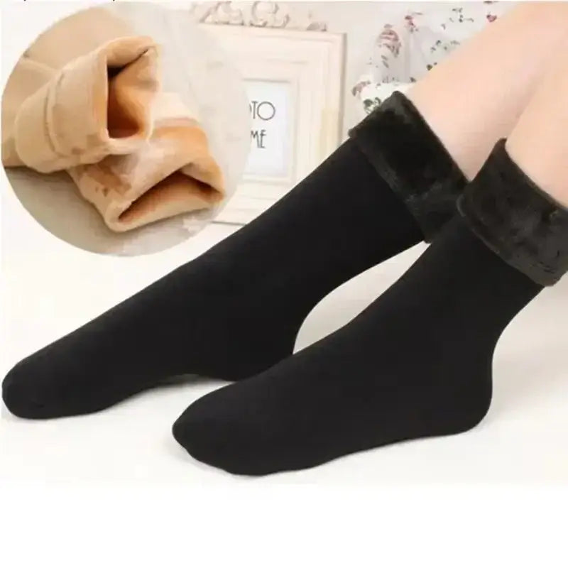 Black ankle-length winter thermal socks with plush dark brown faux fur cuff made of cashmere wool and fleece lined for warmth.