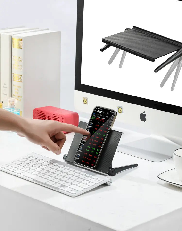 Black carbon fiber adjustable screen top storage shelf monitor stand with adjustable legs holding a smartphone upright.