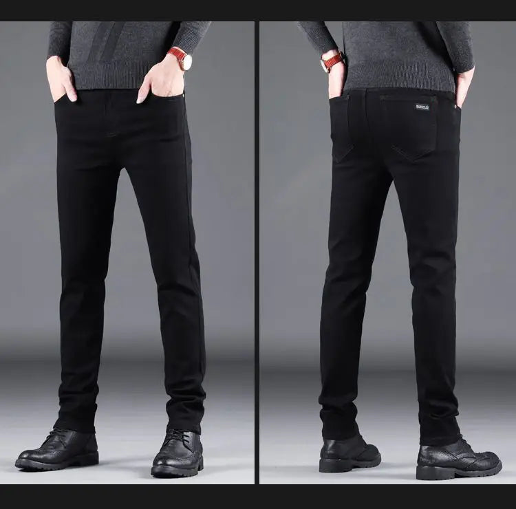 men black slim fit stretch denim jeans shown from the back side featuring a subtle texture and a small brand tag on the back pocket