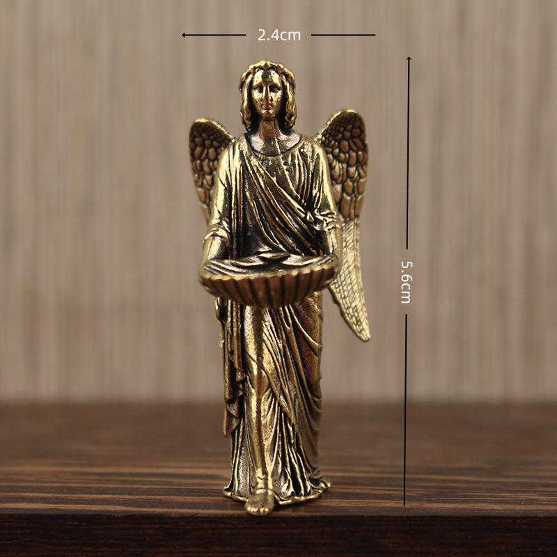 Golden angel figurine home decor statue in gold featuring detailed wings and draped robes holding a shallow bowl.
