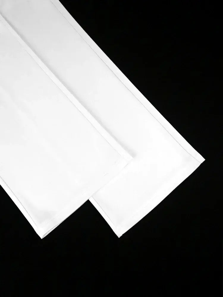 white cotton fabric with neatly folded edges used in a beaded high waisted jumpsuit elegant party outfit