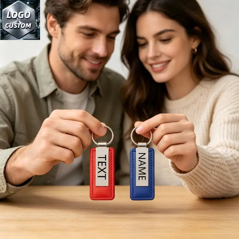 Custom couple leather keychain set featuring red and blue rectangular designs with silver metal rings for personalized matching gifts.