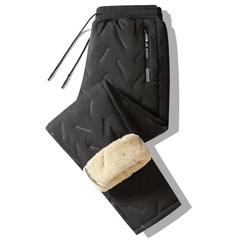 Men fleece lined thermal sweatpants in black with quilted exterior, plush beige fleece lining, and subtle gray geometric stitching for waterproof winter use.