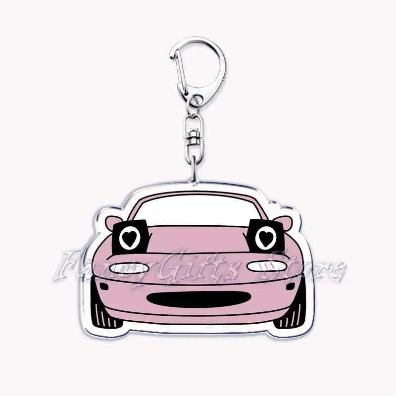 Pink Nissan Skyline acrylic car keychain featuring a cartoon car with heart-shaped eyes and a silver metal clip.
