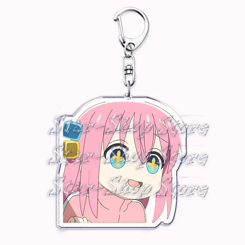 Pink-haired anime character acrylic keychain from Bocchi the Rock featuring blue and yellow eyes with a clear acrylic design and silver metal clasp.