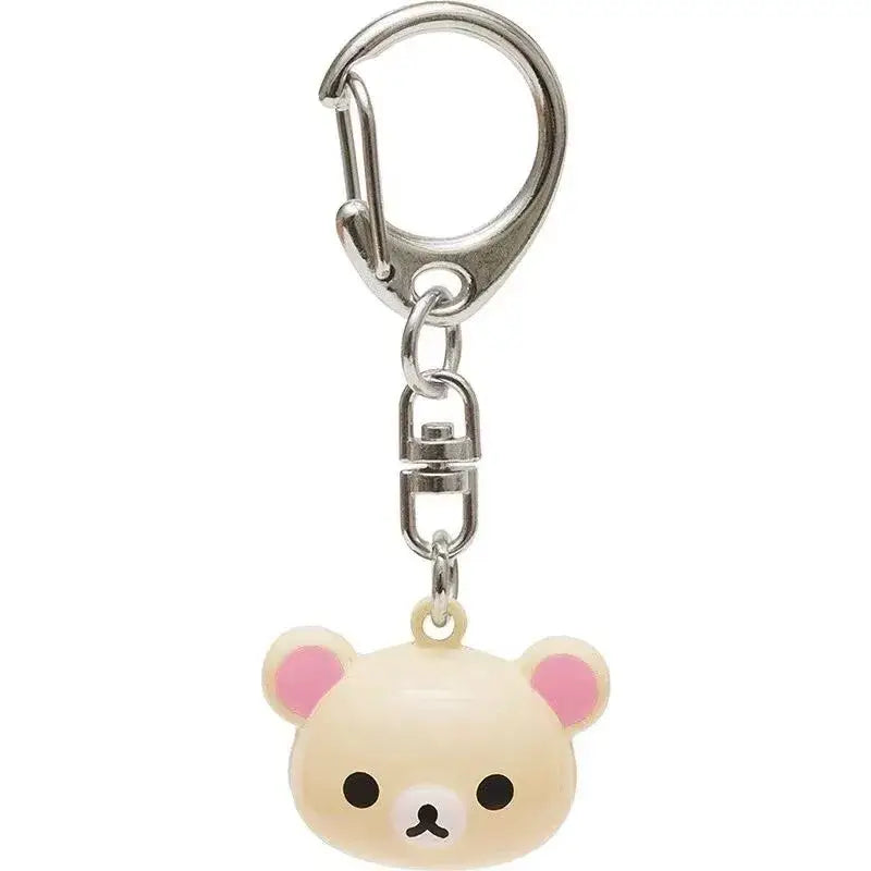 Cream-colored rilakkuma bear keychain with pink inner ears and black eyes attached to a silver-toned metal clip from the rilakkuma bear keychain set cute enamel charms.