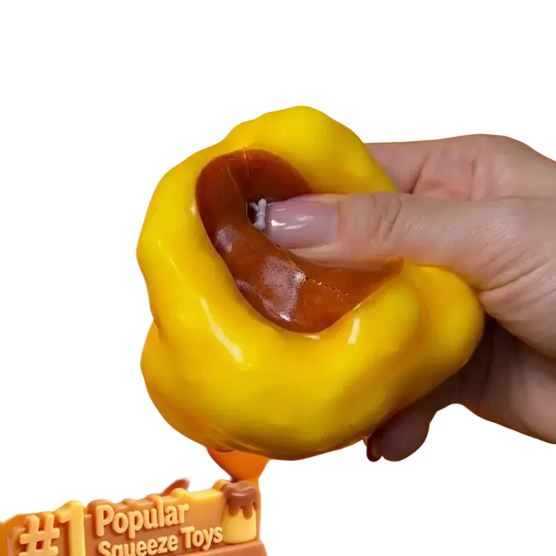 Yellow and brown silicone squeeze toy shaped like a bell pepper shown from the front as a stress ball toy