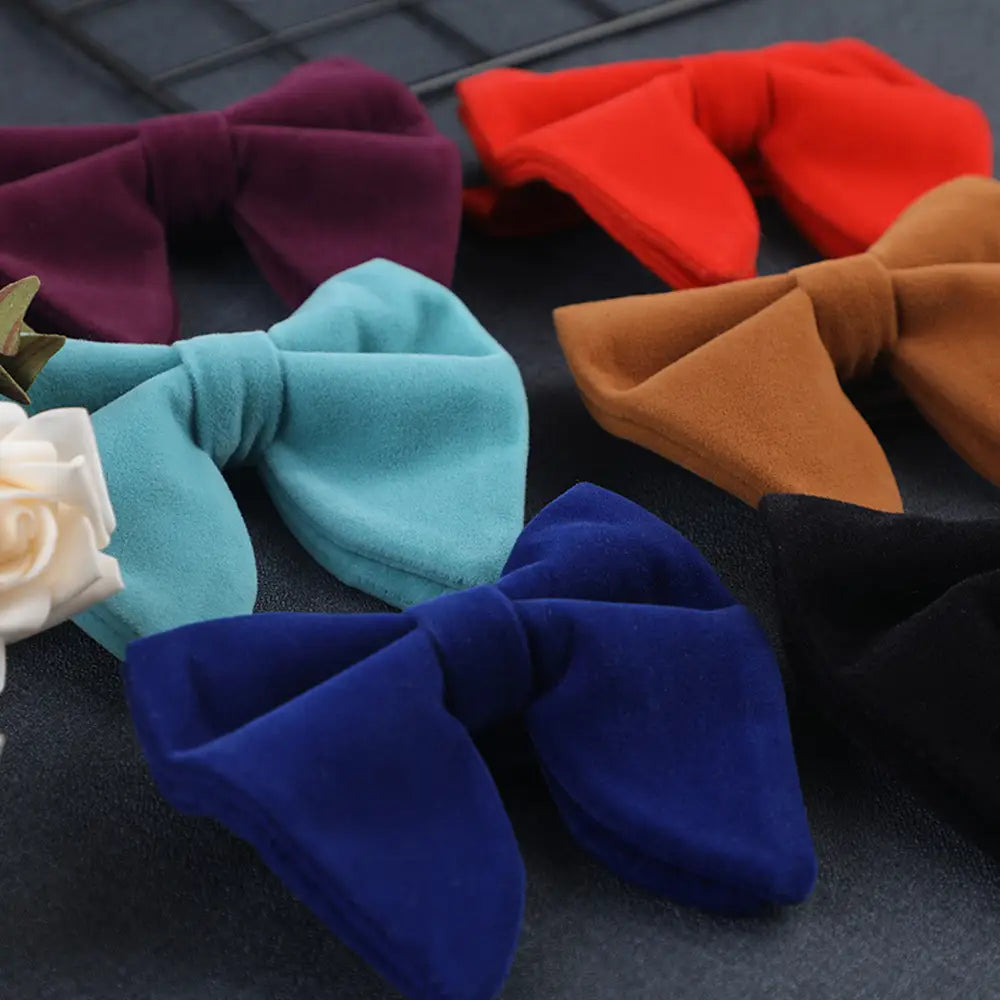 A plush royal blue velvet bow tie designed as formal neckwear and suitable as a gift.