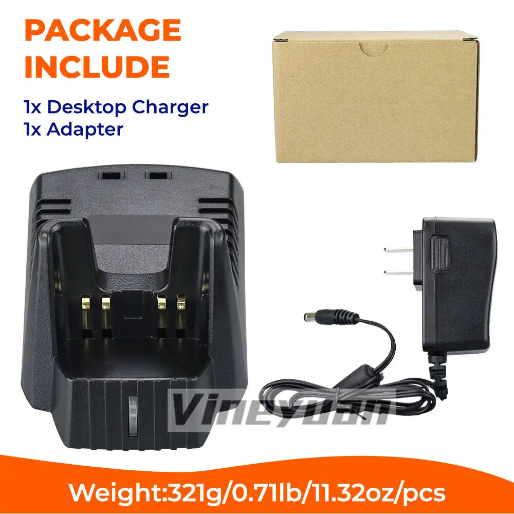 Black plastic battery charger for Vertex Standard radios with gold-colored contacts and matching power adapter displayed on a desktop surface.